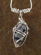 Silver-Wrapped Snowflake Obsidian Pendant